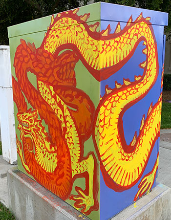 a box with a painting of dragons