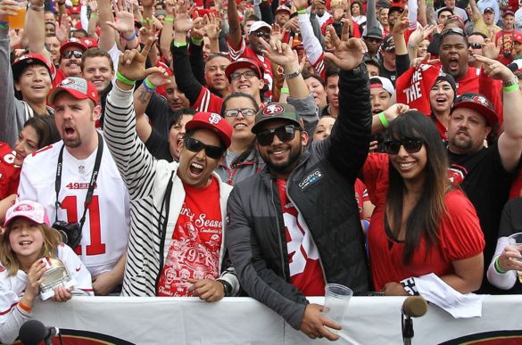 a group of people in red shirts